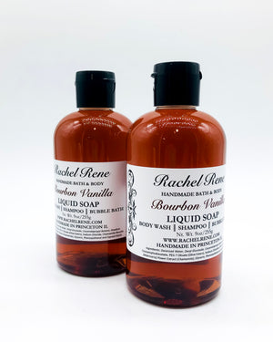 Two semi-transparent brown liquid soaps with white labels that read "Bourbon Vanilla." They have black pull top caps and sit on a white background. The labels face slightly away from each other.