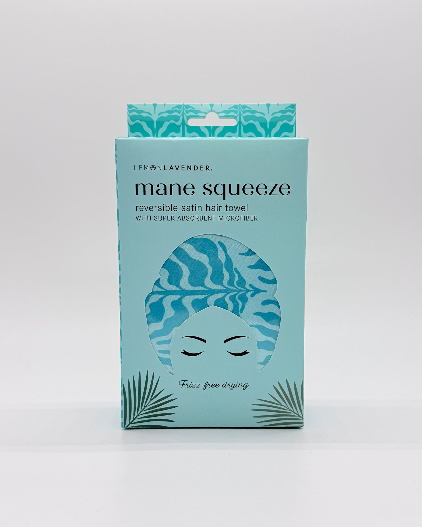 "Mane Squeeze" hair towel packaged in a aqua colored box on a white background