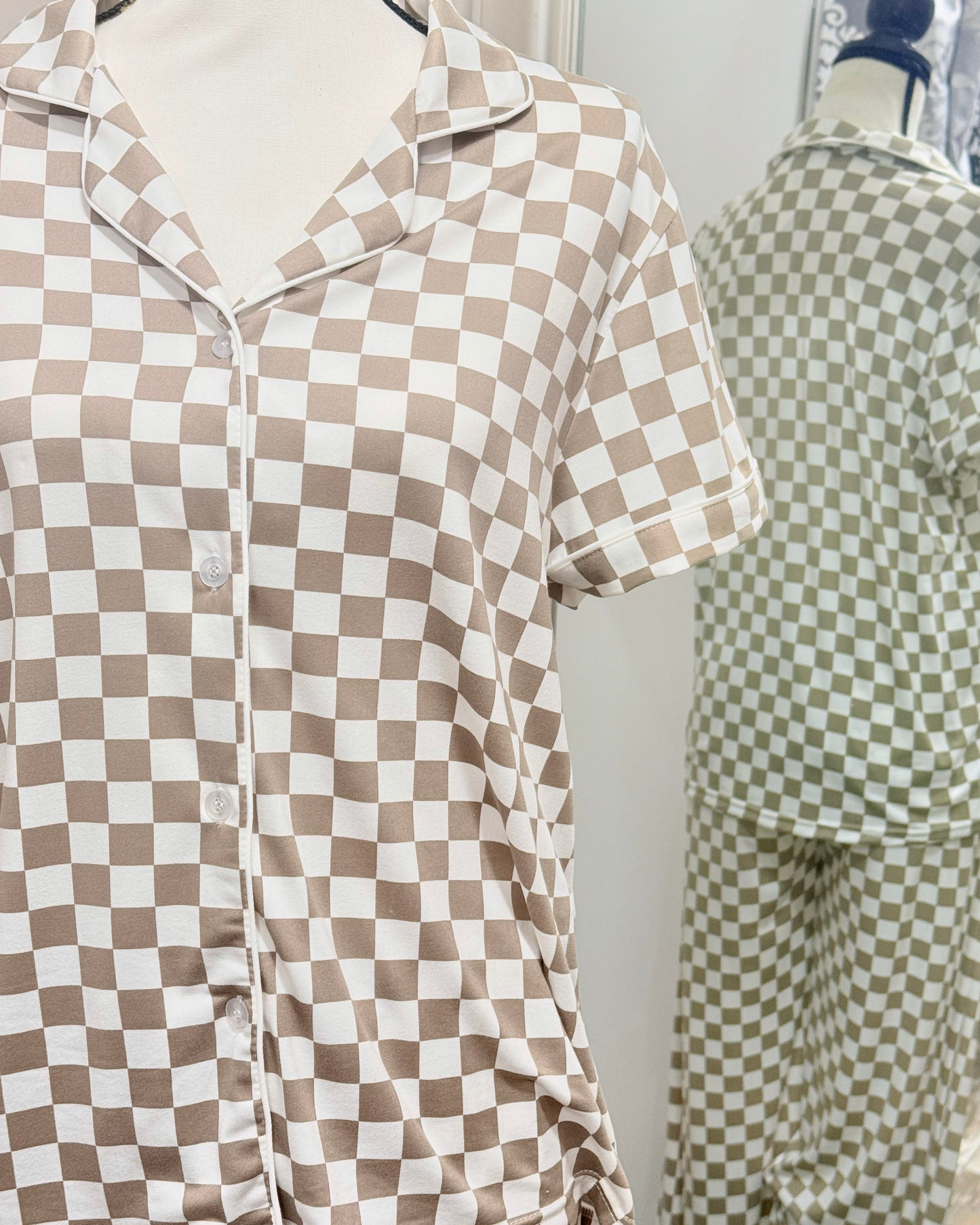 Checkered pajama shirt on a mannequin with a mirror reflection in the background