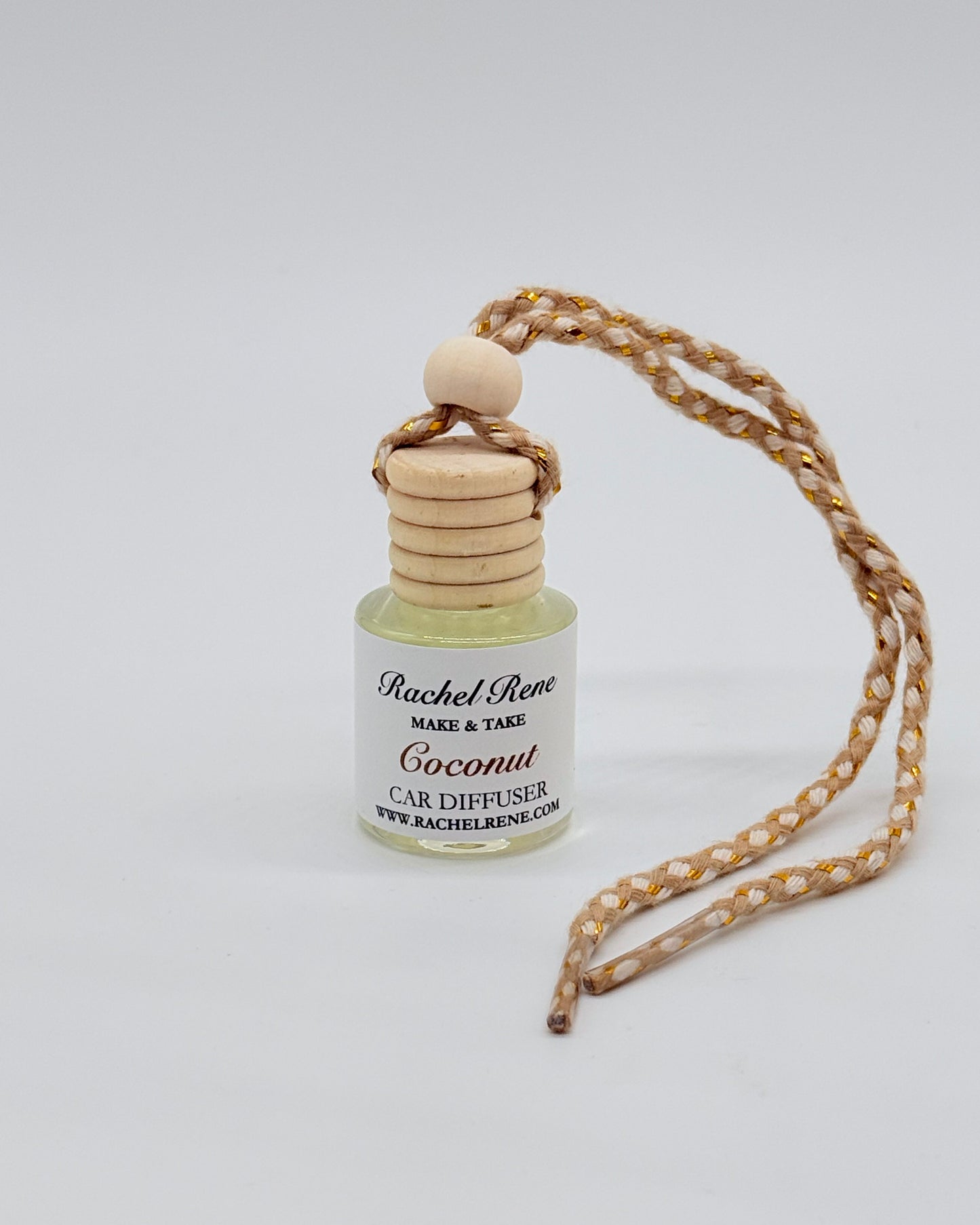Car diffuser with wooden topper and a braided rope string on a white background
