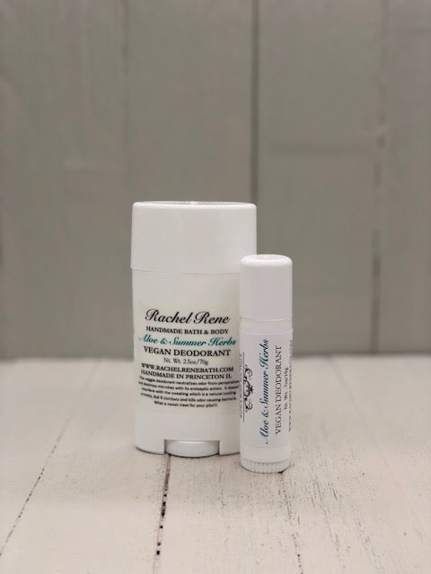A white deodorant stick labeled "Aloe & Summer Herbs" in teal letters.