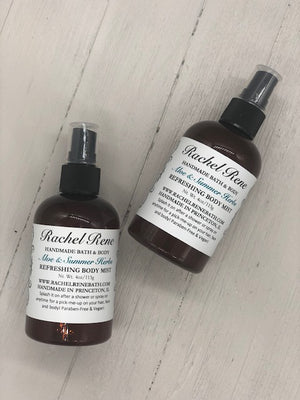Amber spray bottles with white labels that read "Aloe & Summer Herbs"