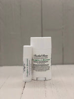 A white deodorant stick labeled "Eucalyptus & Spearmint" in green letters.