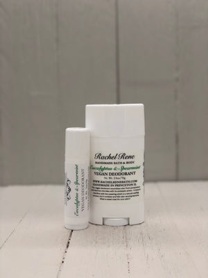 A white deodorant stick labeled "Eucalyptus & Spearmint" in green letters.