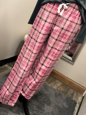Pink plaid pajama pants with black, white, and hot pink detailing.