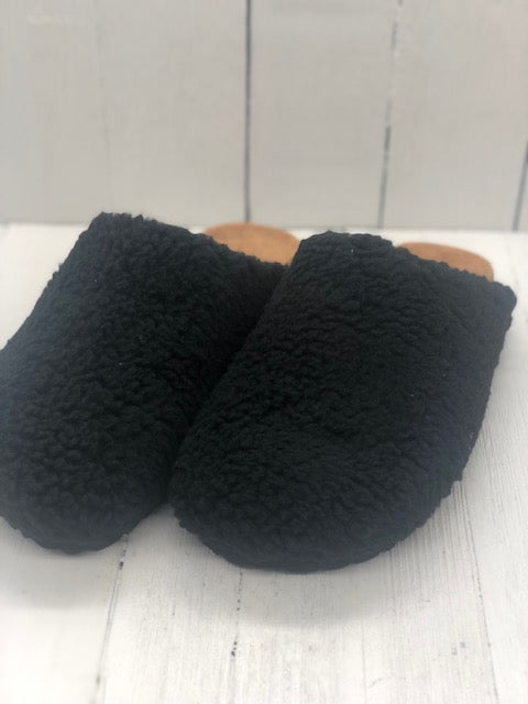 Black sherpa slippers.