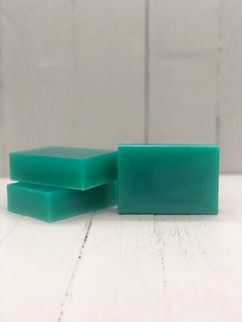 A teal rectangular soap bar.