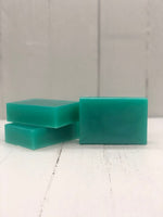A teal rectangular soap bar.