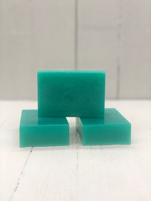 A teal rectangular soap bar.