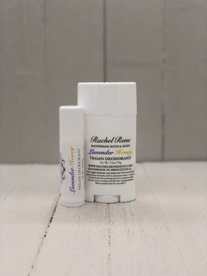 A white deodorant stick labeled "Lavender Honey" in purple and gold letters.