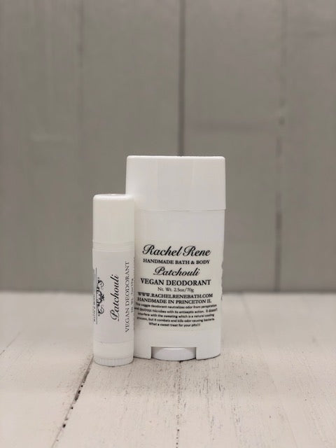 A white deodorant stick labeled "Patchouli" in gray letters.